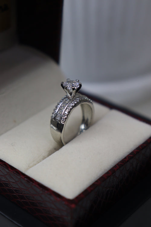American Sovereign Halo Emerald Ring