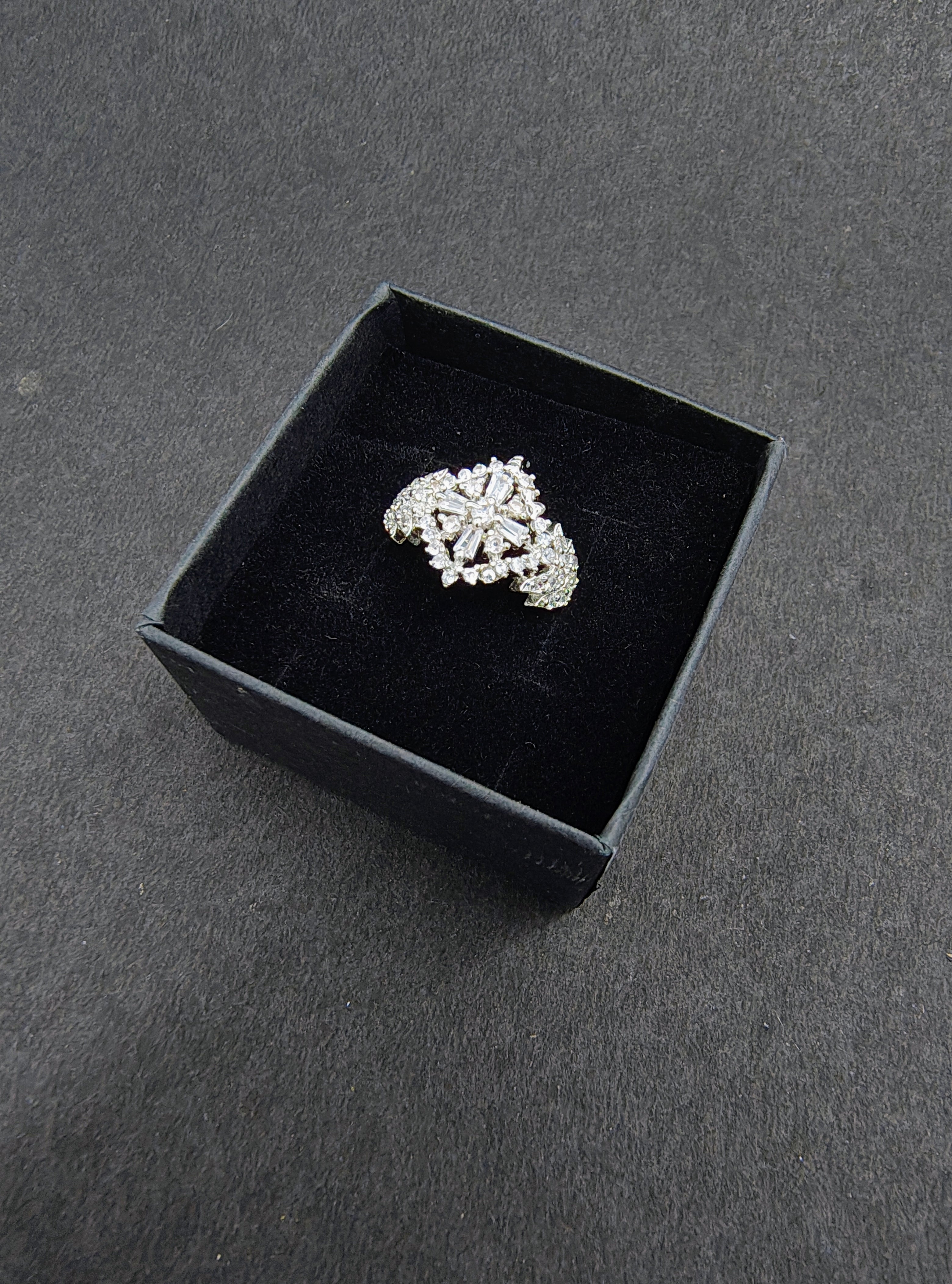 Silver snowflake ring with white stones