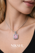 Nikshu Pastel Pink Rectangular Stone Pendant with Zirconia Border